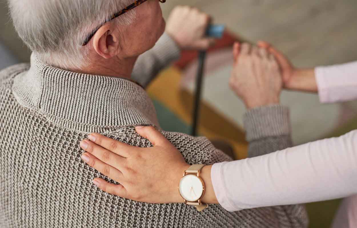 Senior services providing emotional support to an elderly man.